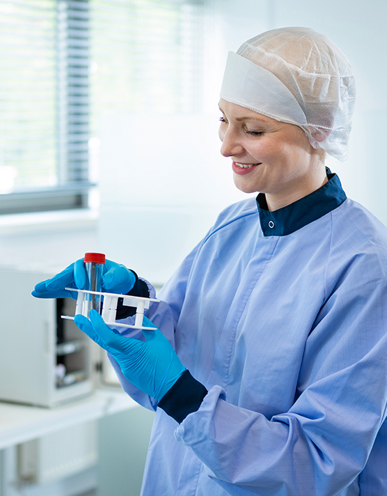 Person holding a test tube with Satatuote’s high-quality products.