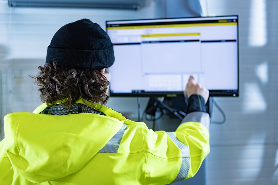 Worker analyzing warehouse management on a screen